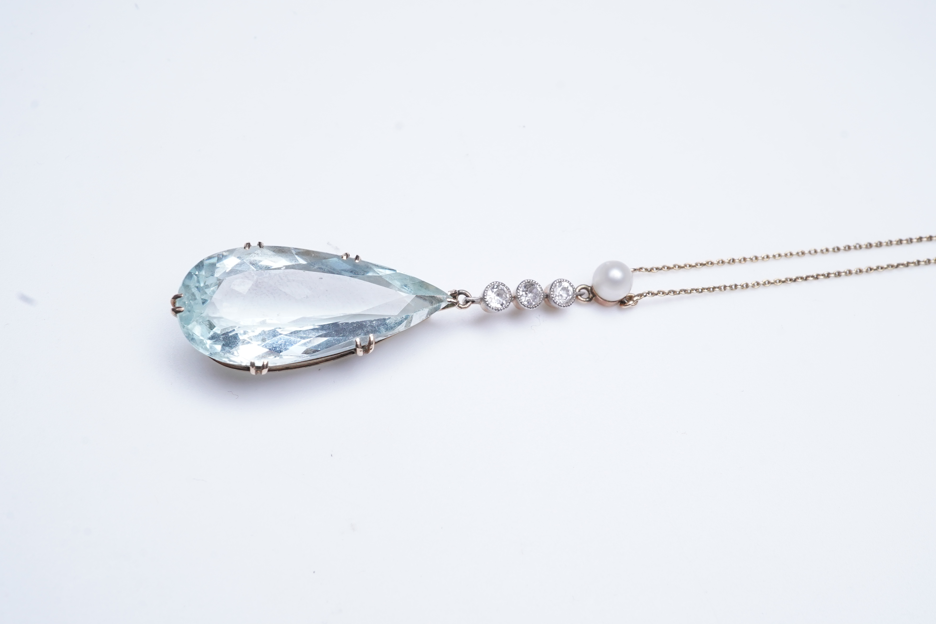 An Edwardian aquamarine, pearl and diamond pendant, early 20th century